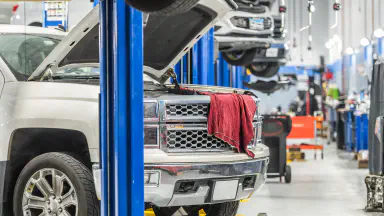 Cars in a car dealership service area