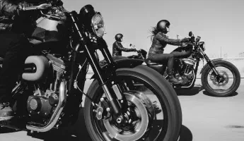Three Harley Davidson motorcycles on the highway