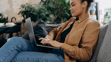 “User comparing auto transport quotes on bidding website”